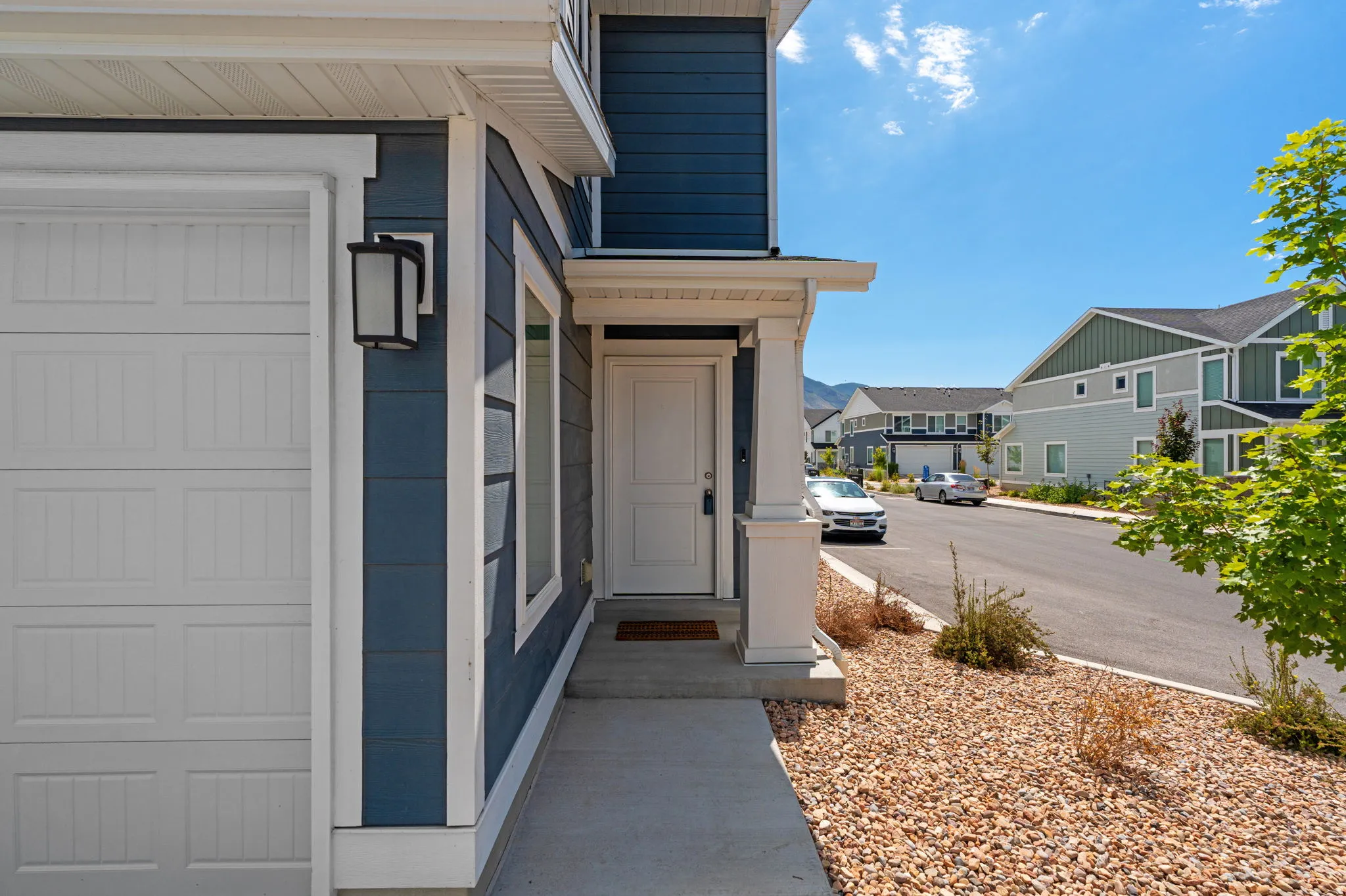2 Story Townhome. End Unit. Lovely blue hardyboard siding. Porch. Front door and back entrnaces! Lots of parking, including in the driveway. 2 car garage.