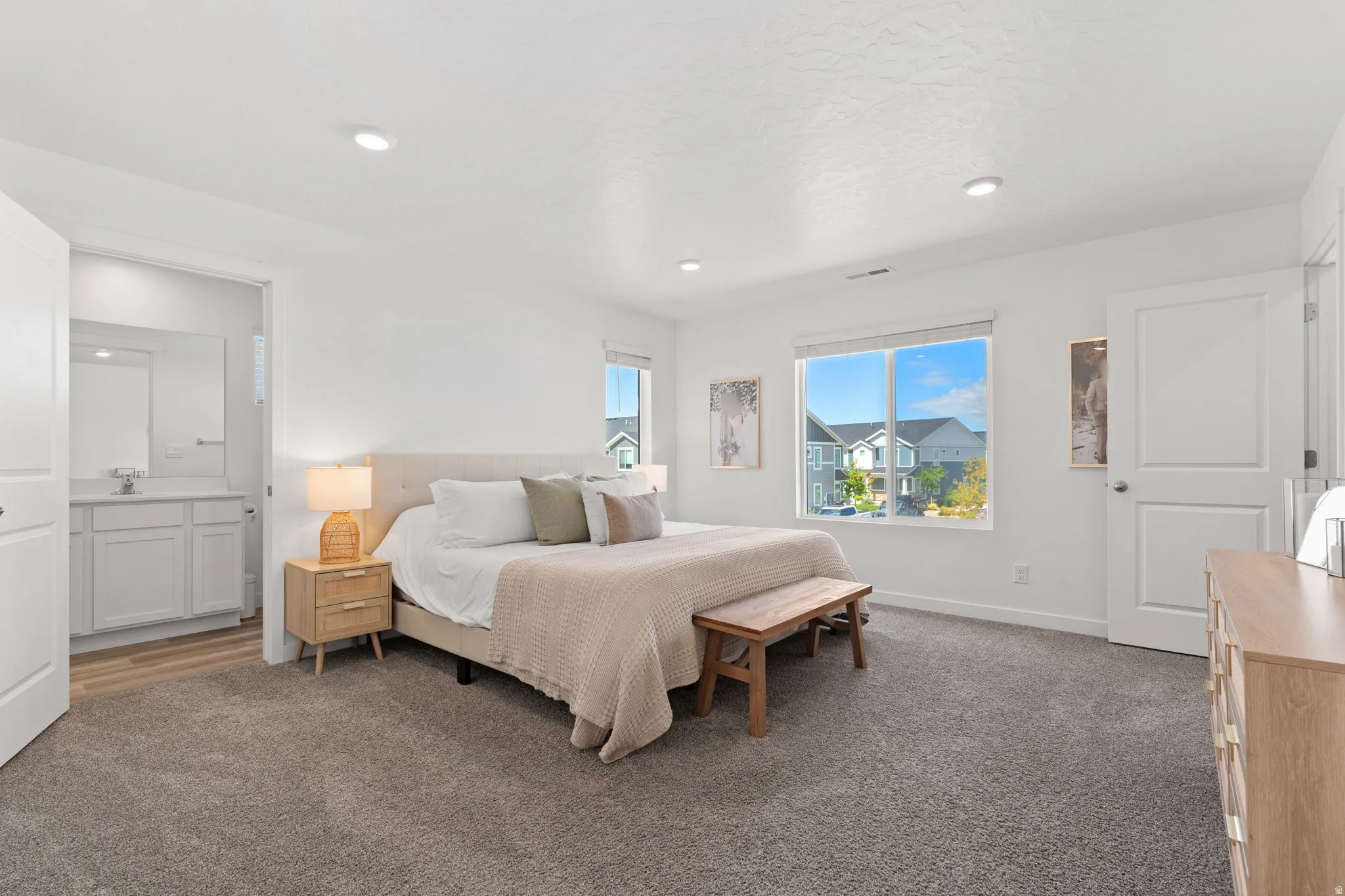 Spacious primary bedroom 1. Can lights. Large windows. Primary ensuite and walk in closet.