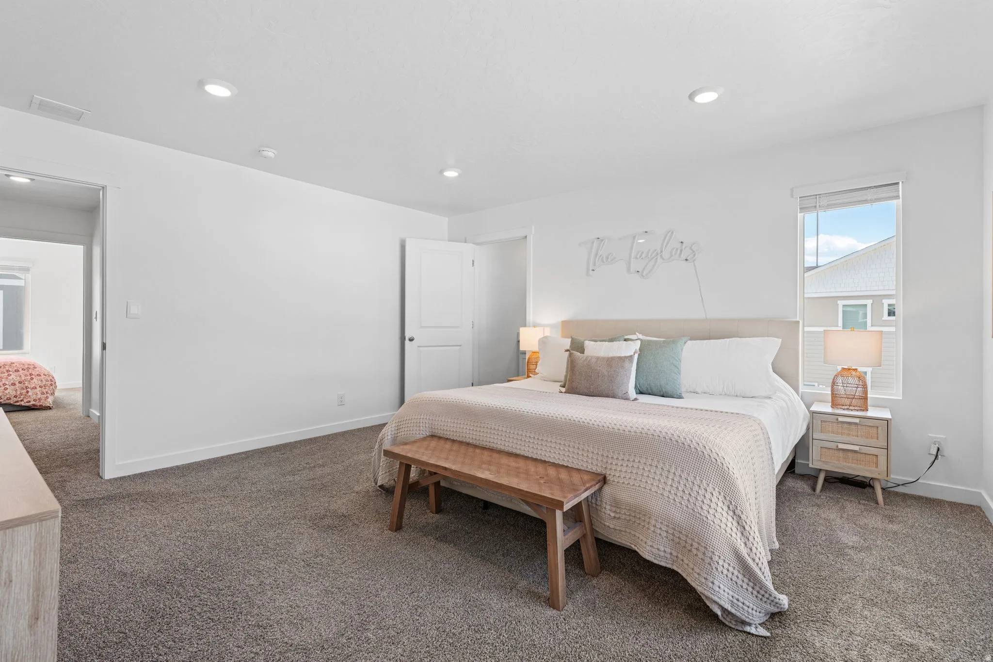 Spacious primary bedroom 1. Can lights. Large windows. Primary ensuite and walk in closet.