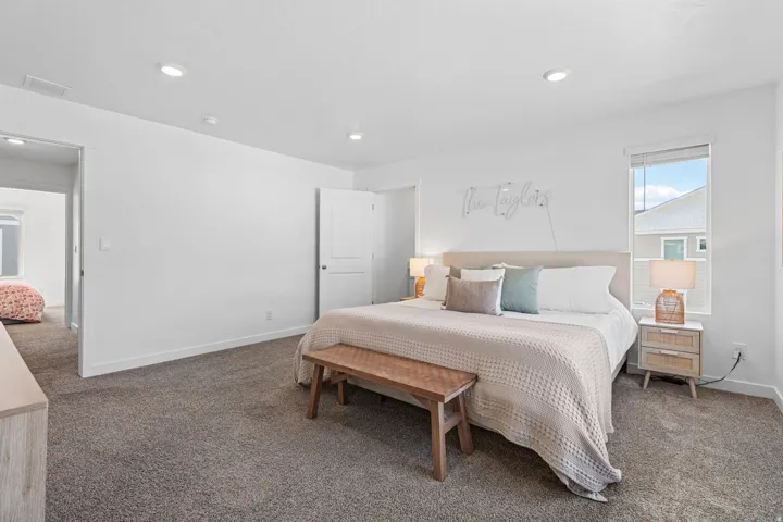Spacious primary bedroom 1. Can lights. Large windows. Primary ensuite and walk in closet.