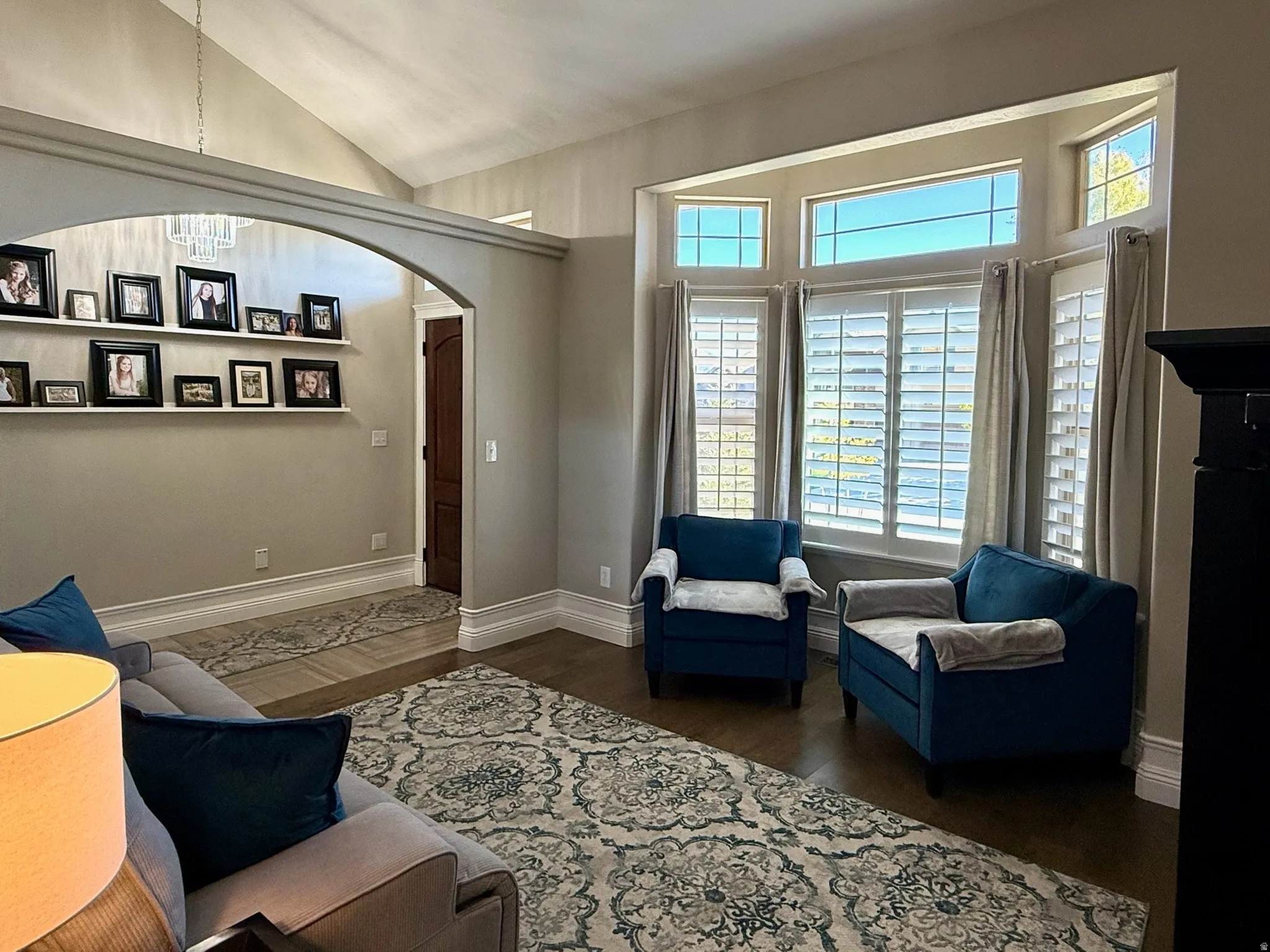 Bay window with white plantation shutters and transom windows