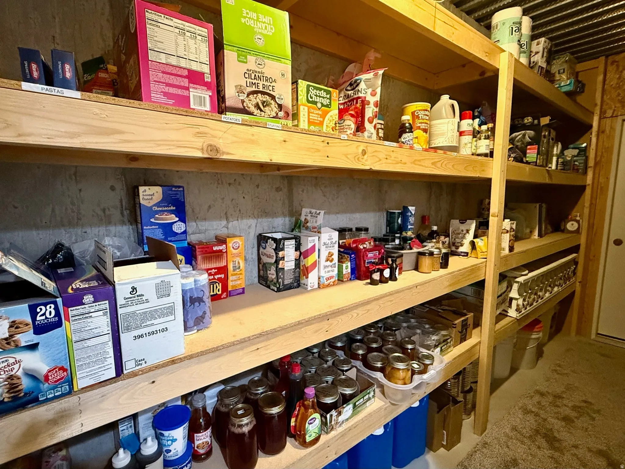 Cold Storage- Dedicated storage area featuring extensive wood shelving units