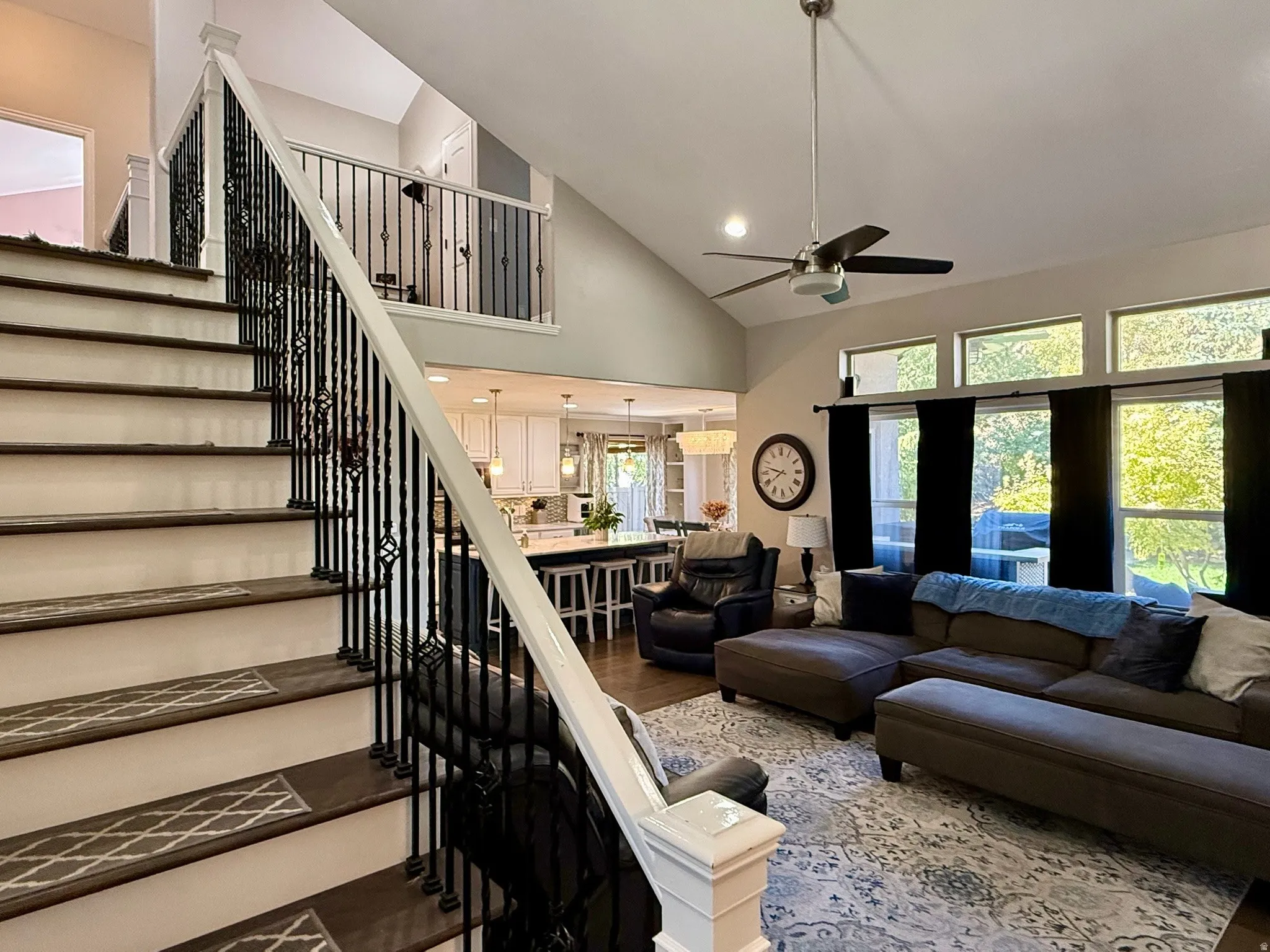 Hardwood staircase with decorative wrought iron balusters