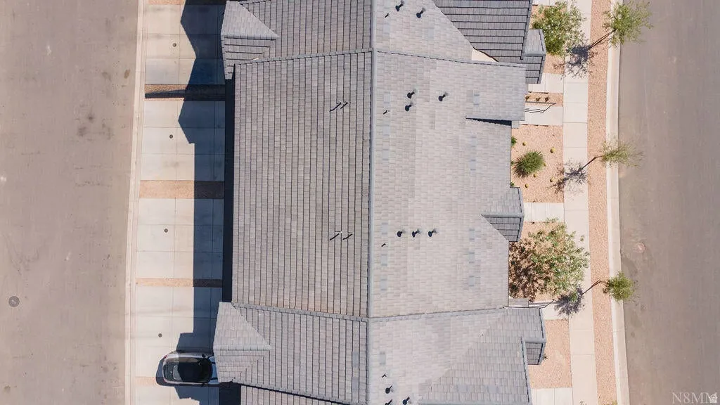 Multi-pitch roofline with light gray shingles