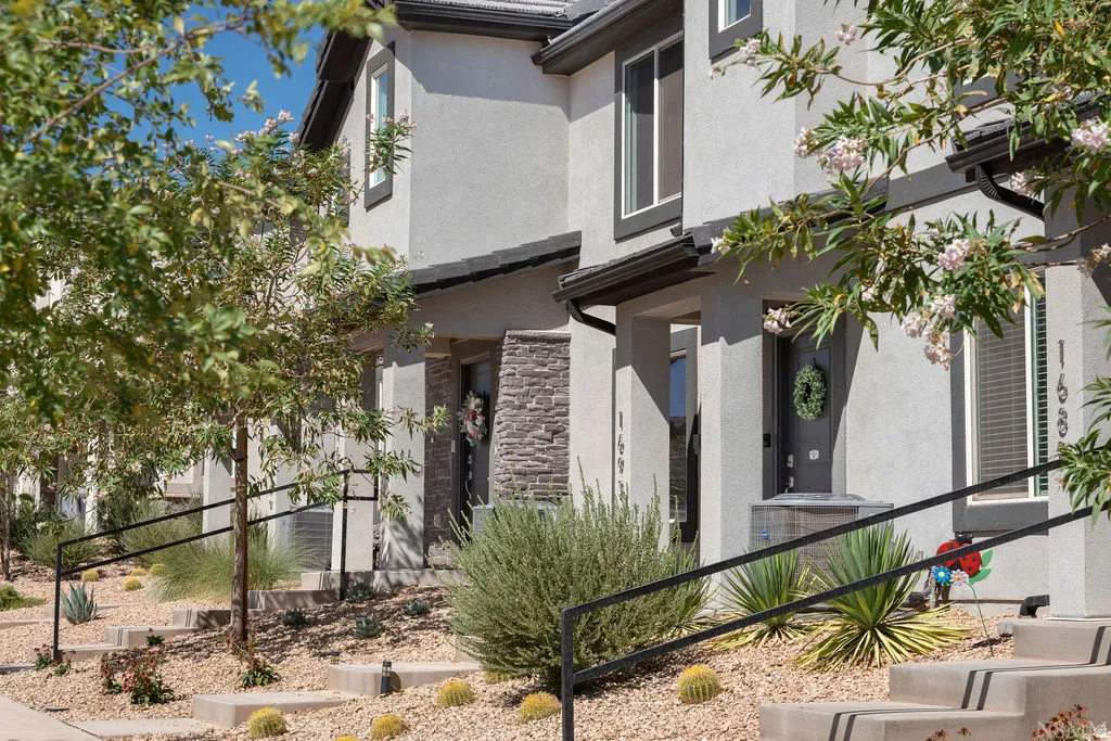 Contemporary stucco exteriors with dark trim accents