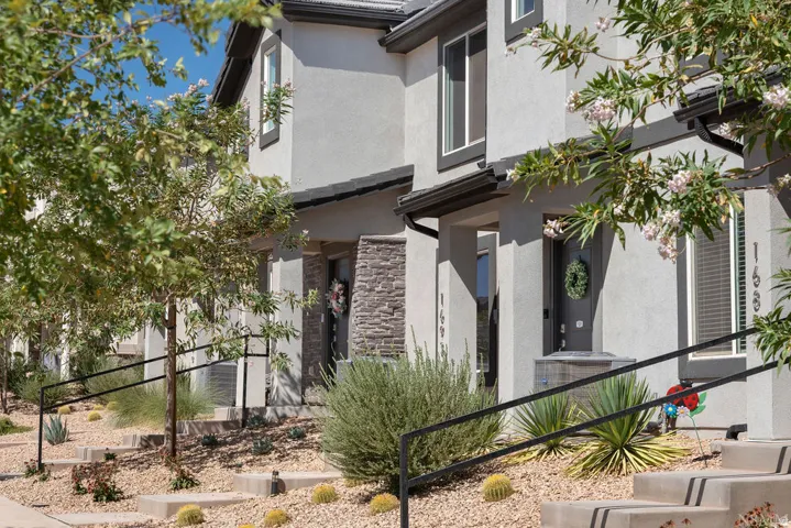 Contemporary stucco exteriors with dark trim accents