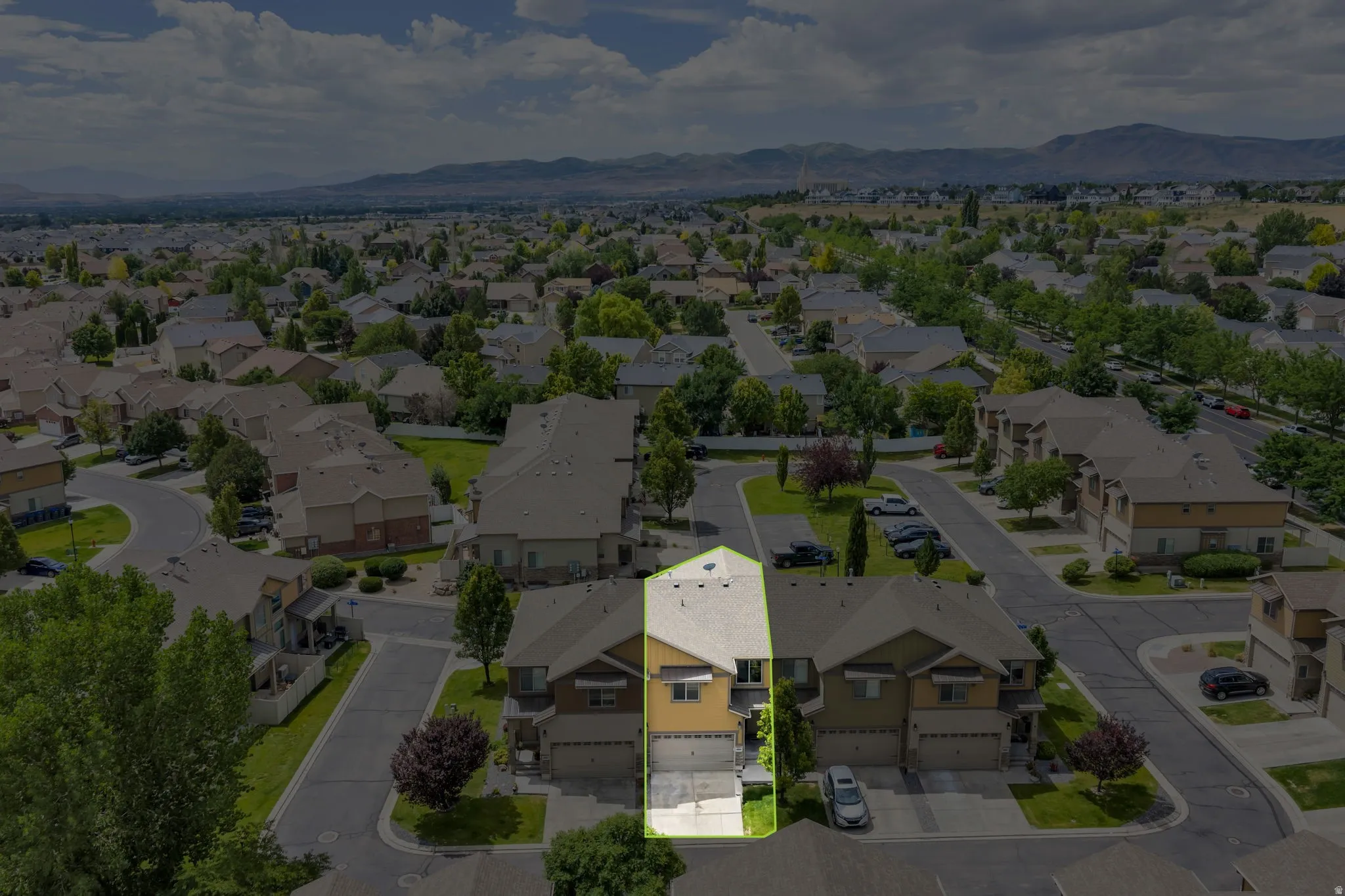 Gabled roofline property featuring a two-story design, attached garage, and a concrete driveway