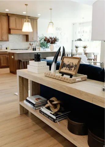Open-concept living area featuring light wood-finish flooring