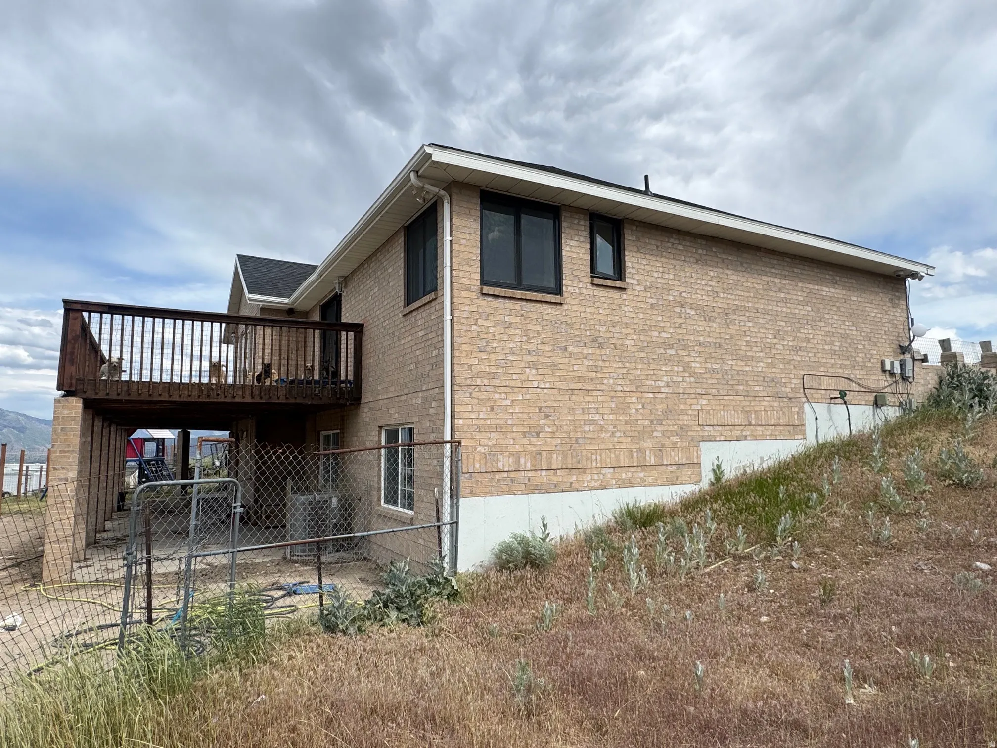 Brick exterior featuring a multi-level deck