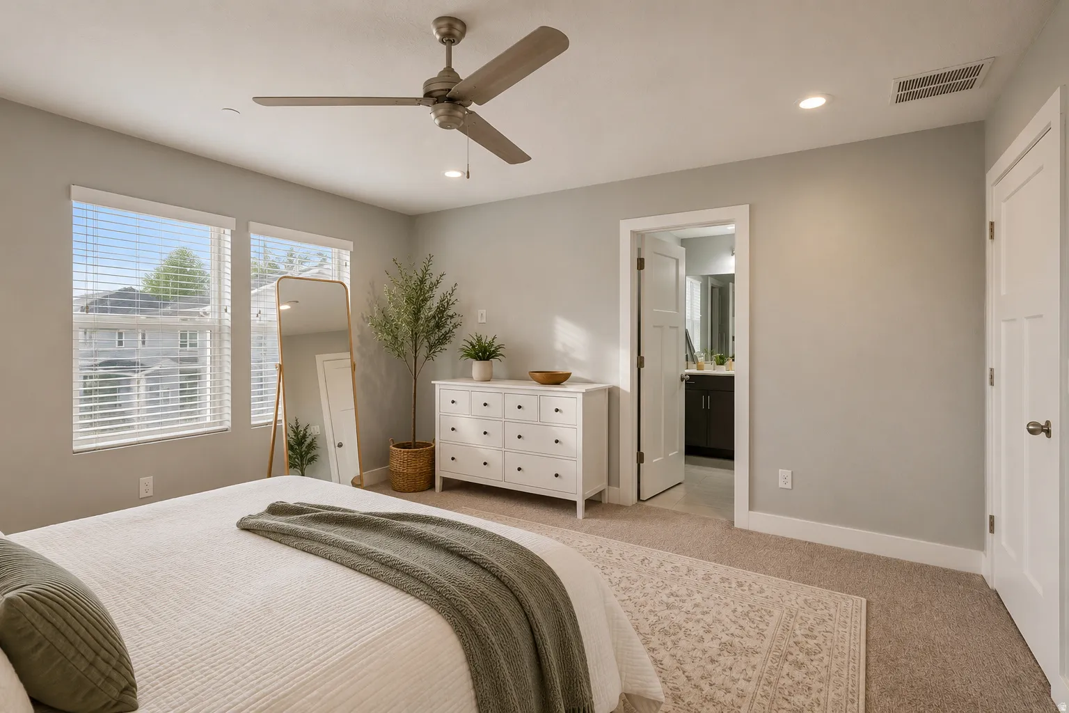 Bedroom featuring a ceiling fan with light, recessed lighting, and a neutral color palette