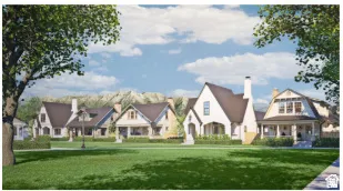 Community green space featuring manicured lawns, mature trees, and a backdrop of mountainous terrain