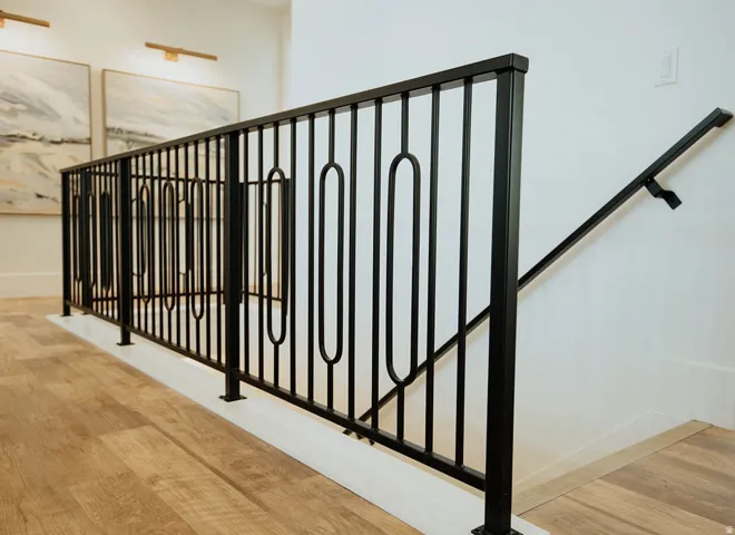 Contemporary black metal railing with decorative balusters