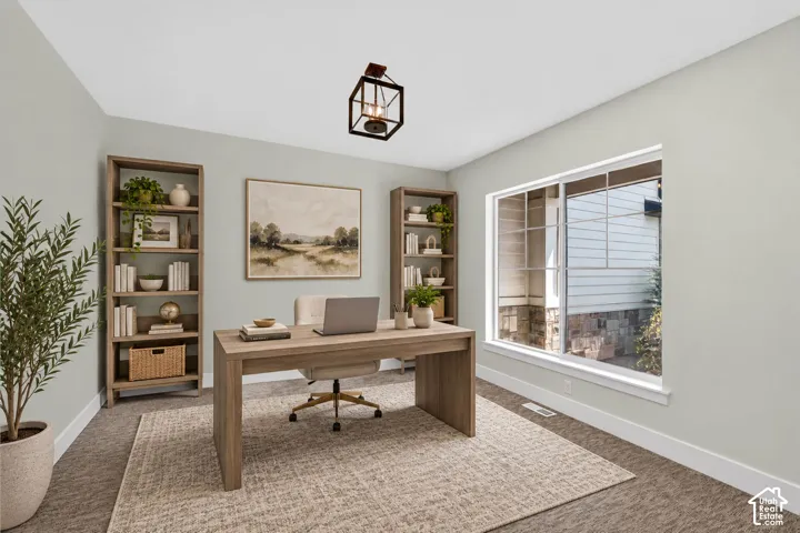 Recessed lighting, large window with white trim, wall-to-wall carpeting, and a ceiling-mounted light fixture