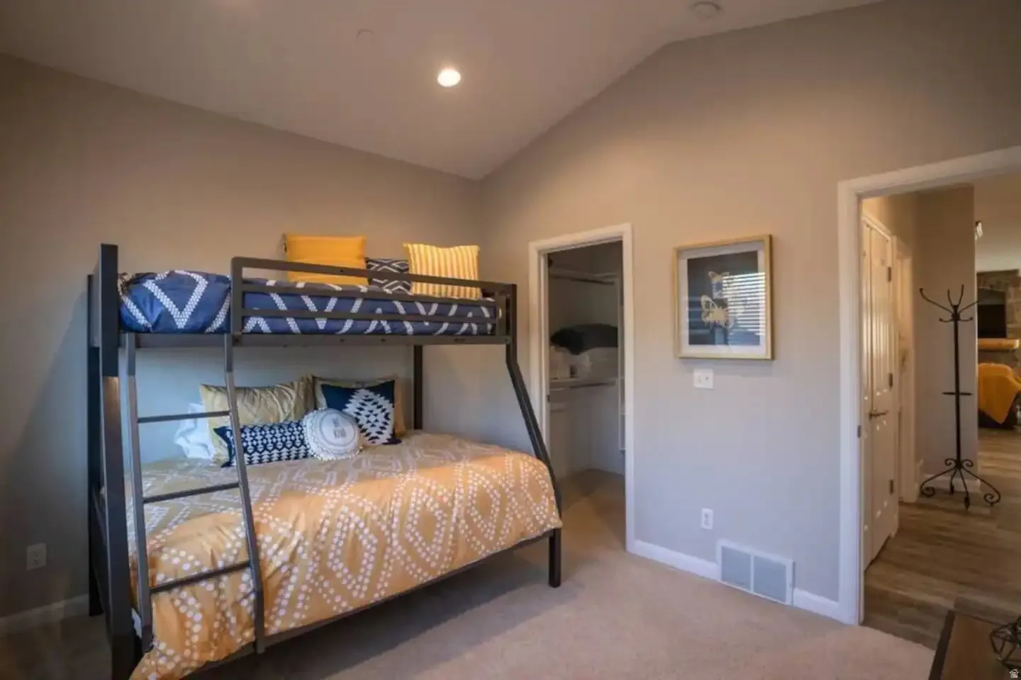 Interior room featuring a vaulted ceiling and recessed lighting