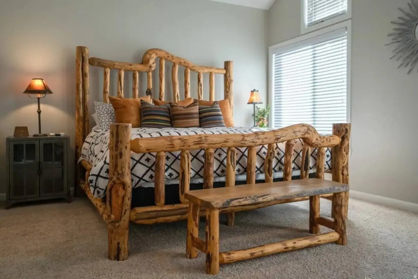 Vaulted ceiling bedroom featuring natural wood-finish architectural elements