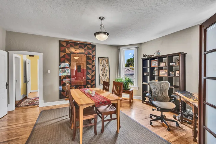 Hardwood floors,  bay  windows with natural light, and lots of natural light.