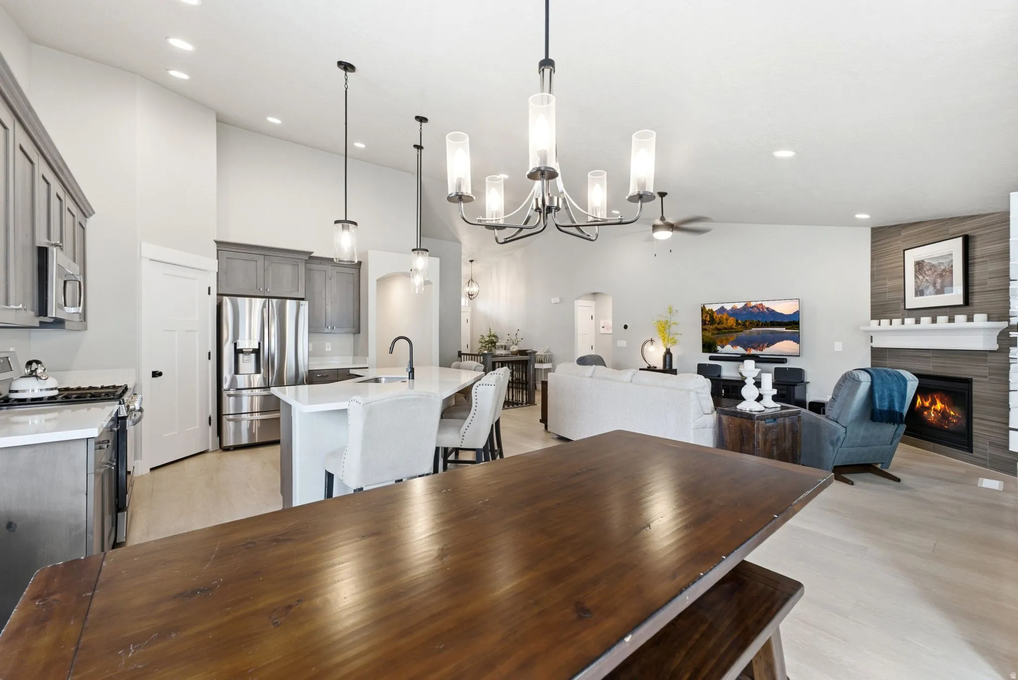 Open-concept living area with light wood-finish flooring