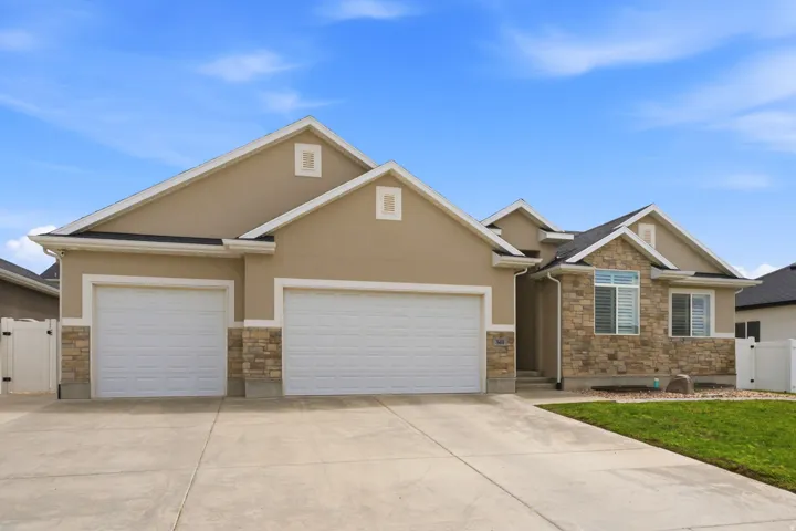 Contemporary exterior featuring stone accents and stucco siding