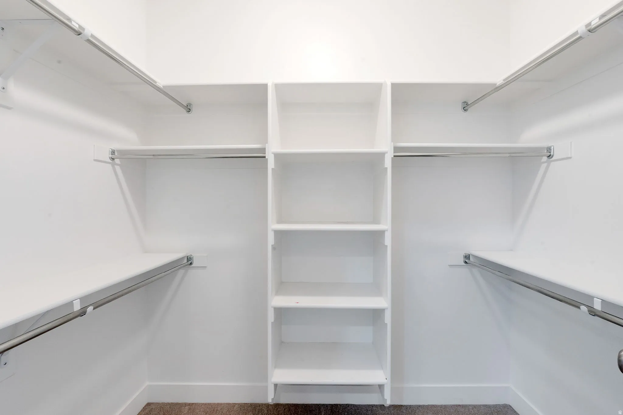 Built-in shelving unit with multiple shelves and hanging rods