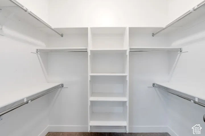 Built-in shelving unit with multiple shelves and hanging rods
