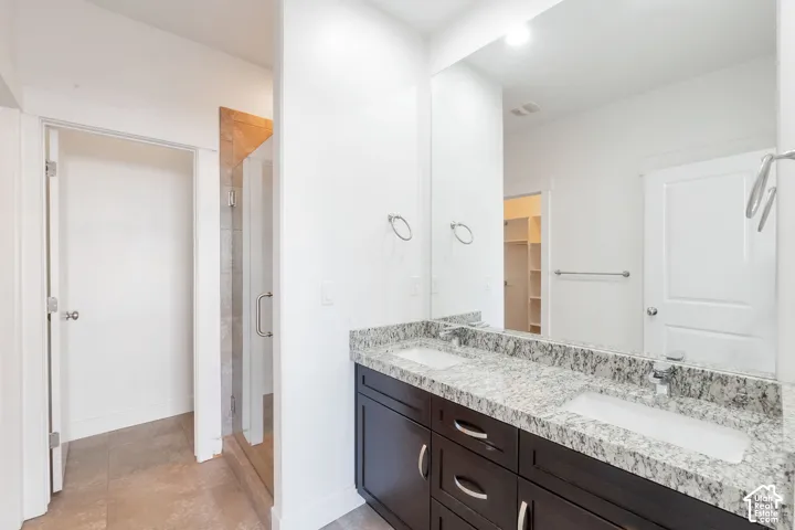 Dual vanity with integrated sinks and a stone-finish countertop