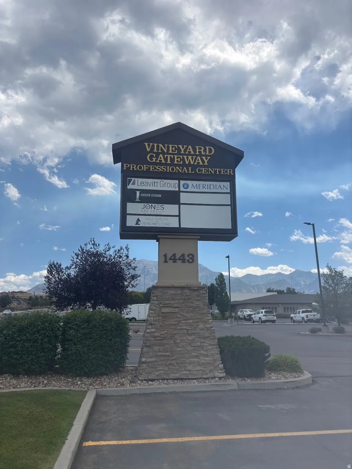 Vineyard Gateway Professional Center monument sign featuring a stone-clad base, integrated address numbering, and multiple tenant directory panels