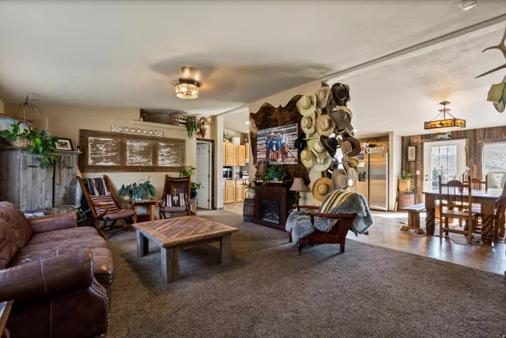 Spacious living area featuring neutral carpet and an integrated fireplace