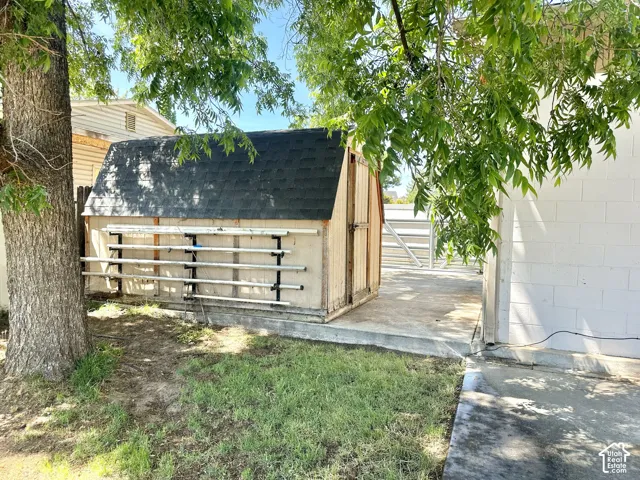 Freestanding storage shed with an asphalt shingle roof