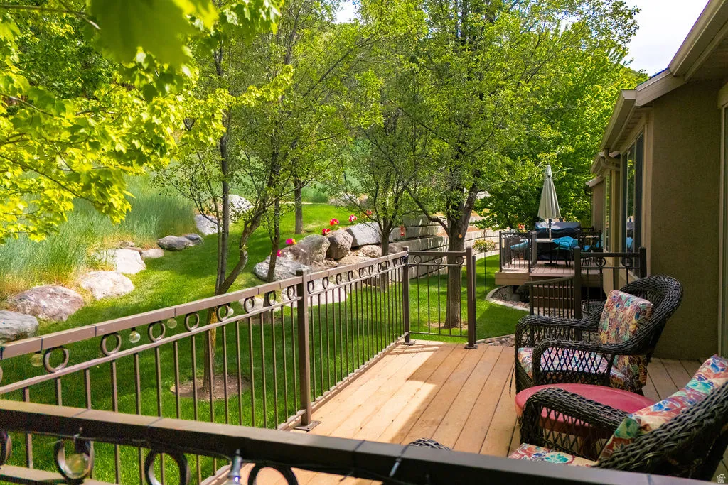 Multi-level deck featuring composite decking and decorative metal railings