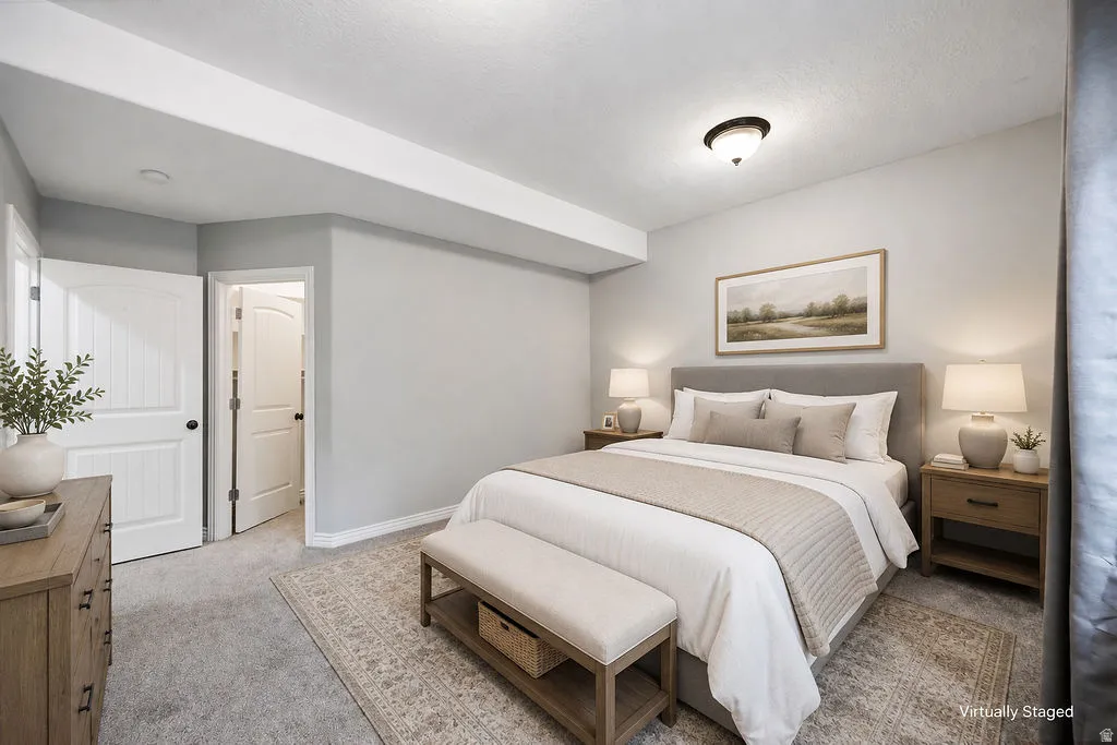 Carpeted room with light gray walls, white trim, and a semi-flush mount ceiling light fixture