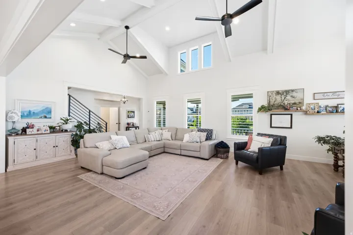 Vaulted ceilings featuring exposed beams and recessed lighting
