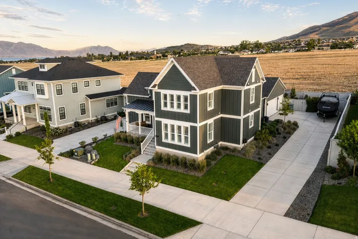Contemporary two-story residence with dark siding and white trim