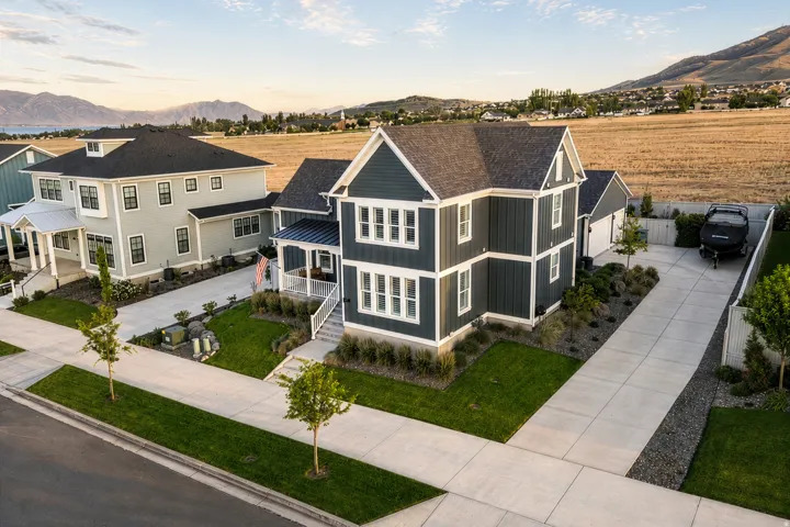 Contemporary two-story residence with dark siding and white trim