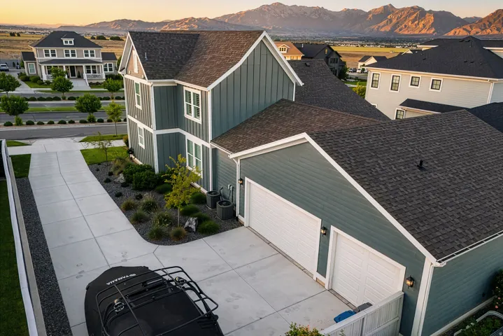 Contemporary two-story residence featuring blue siding and white trim