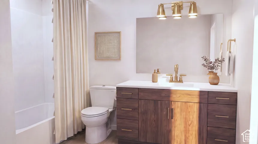 Bathroom featuring a wood-finish vanity with ample storage, a white countertop, and a rectangular undermount sink