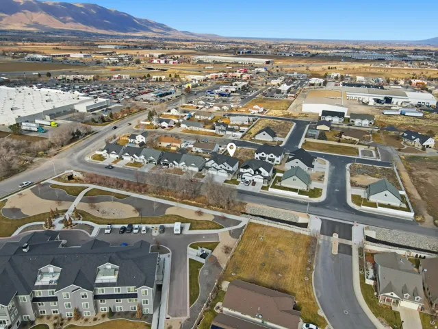 Aerial perspective showcasing a residential development with a mountain backdrop