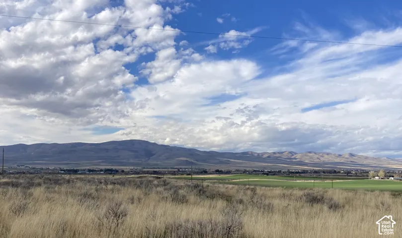 Rural landscape featuring beautiful mountain views among a quiet residential community.