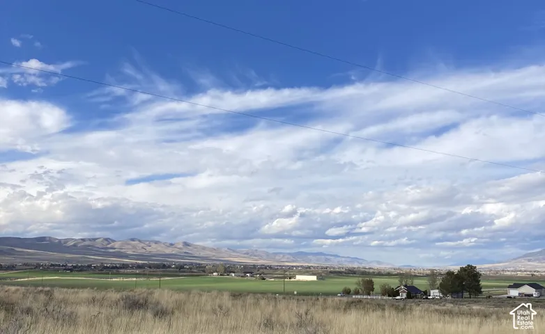Rural landscape featuring beautiful mountain views among a quiet residential community.