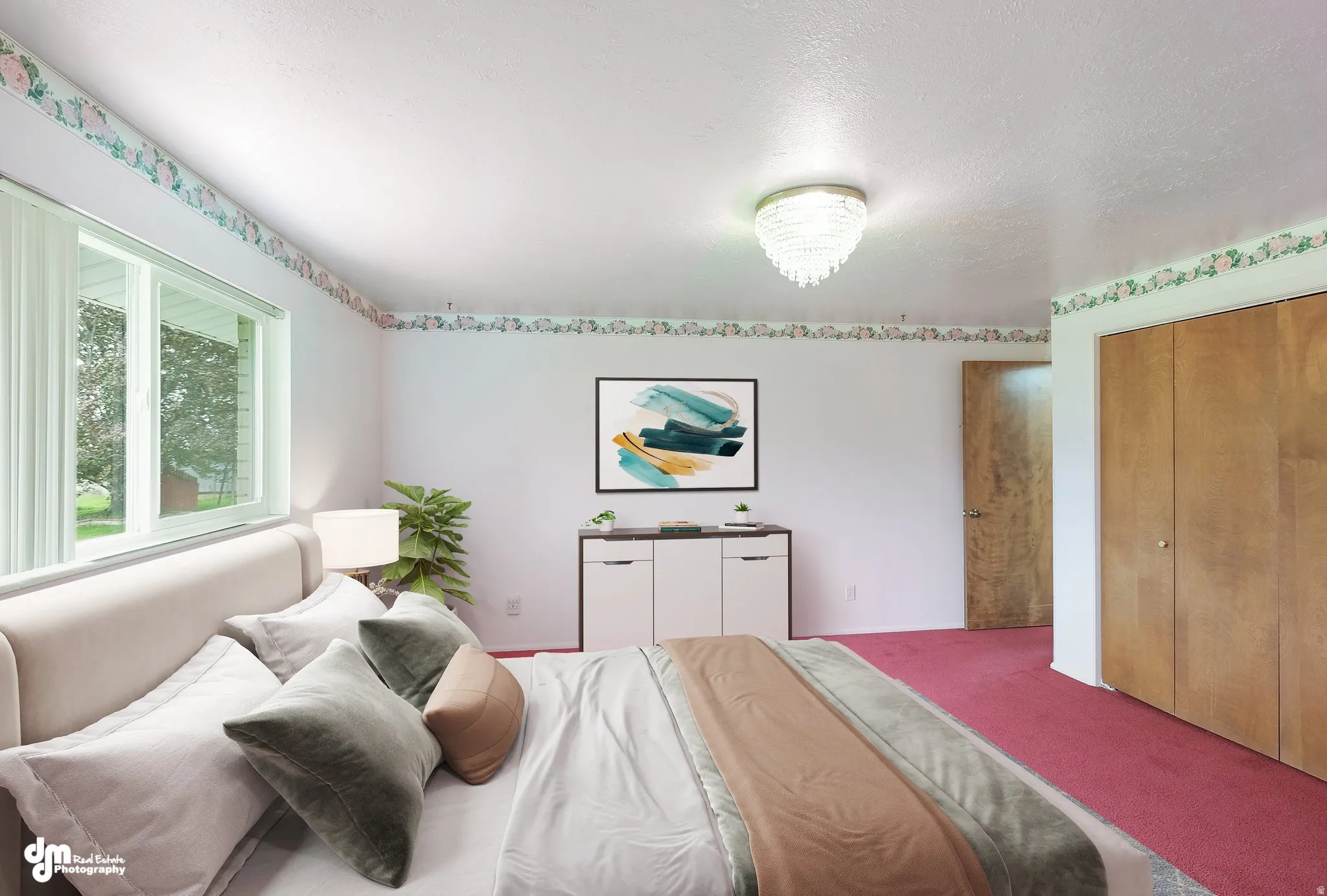 Large window, wood-finish closet doors, recessed lighting, and wall-to-wall carpeting
