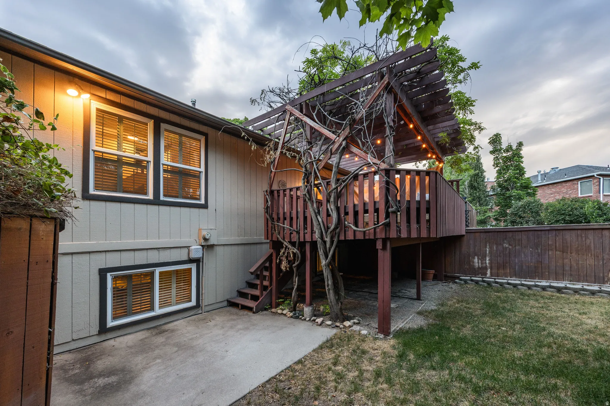 Exterior siding with multiple windows featuring horizontal blinds