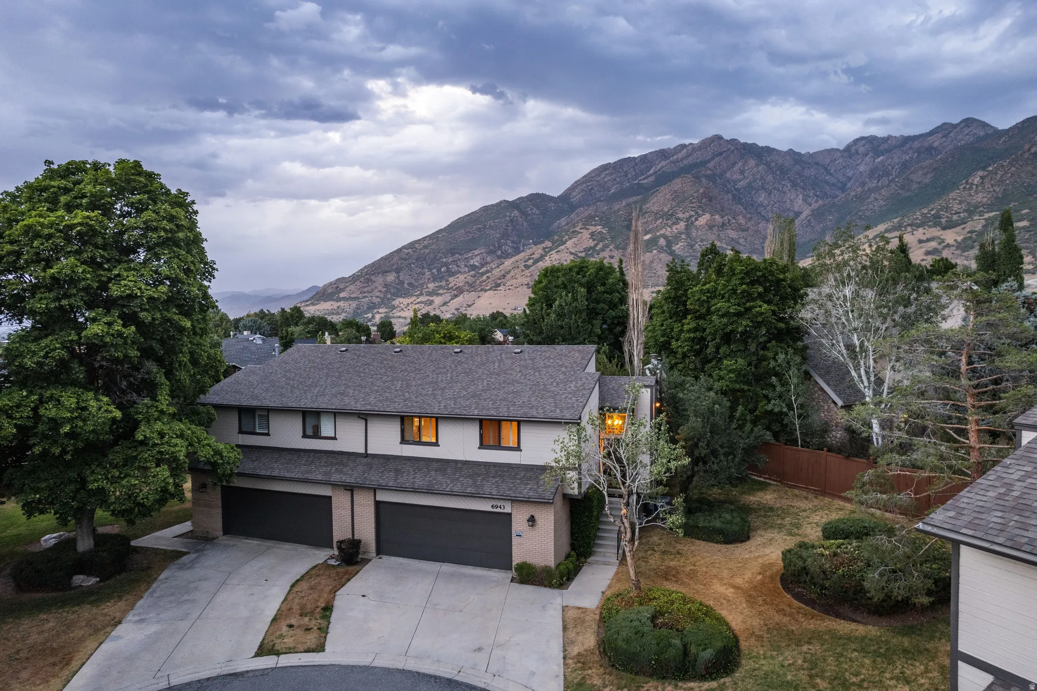 Townhome exterior with a dual-car garage and concrete driveway