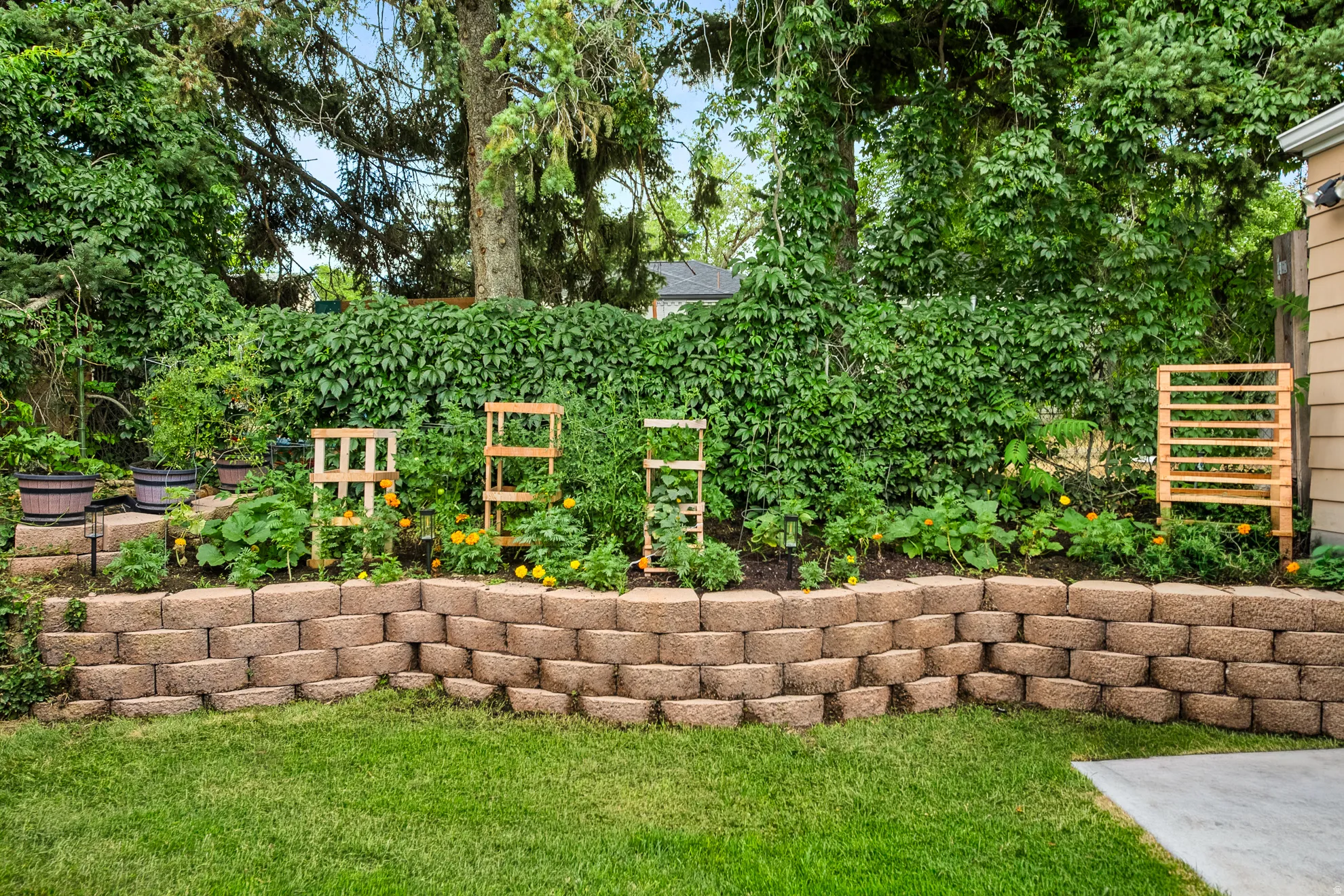 Tiered retaining wall with planted garden beds