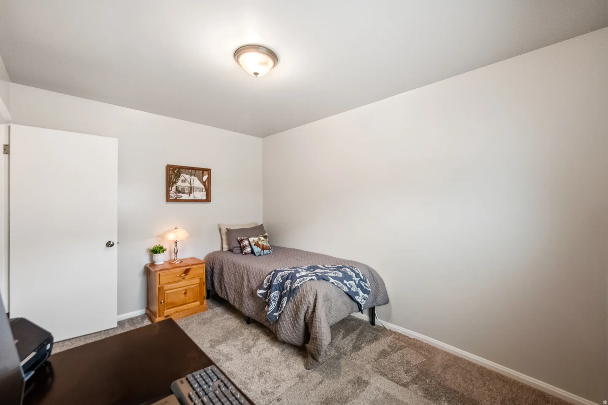 Neutral wall palette with a flush-mount ceiling light
