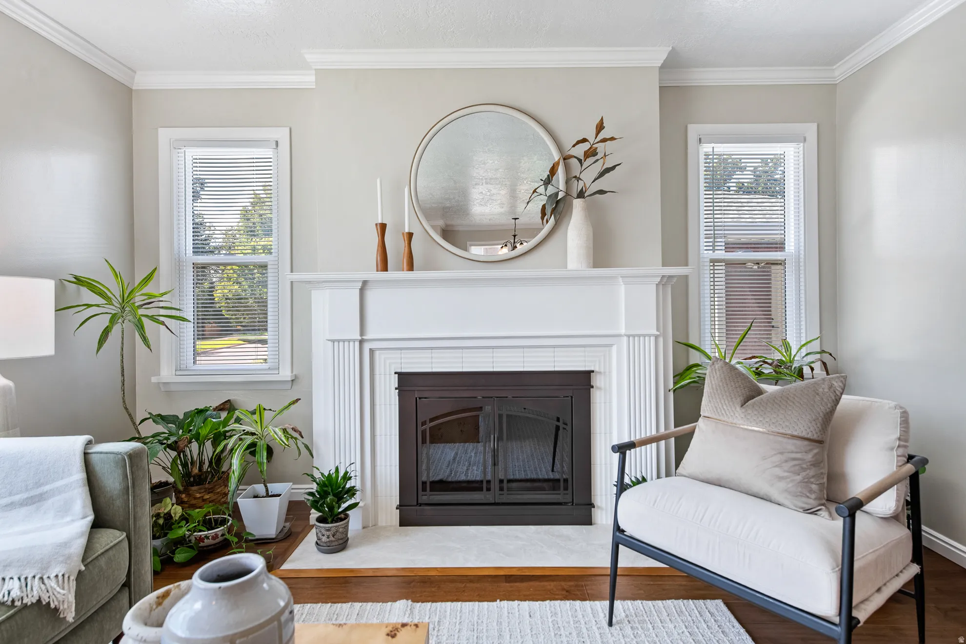 White-painted fireplace surround with mantel, tile hearth, and dark metal firebox