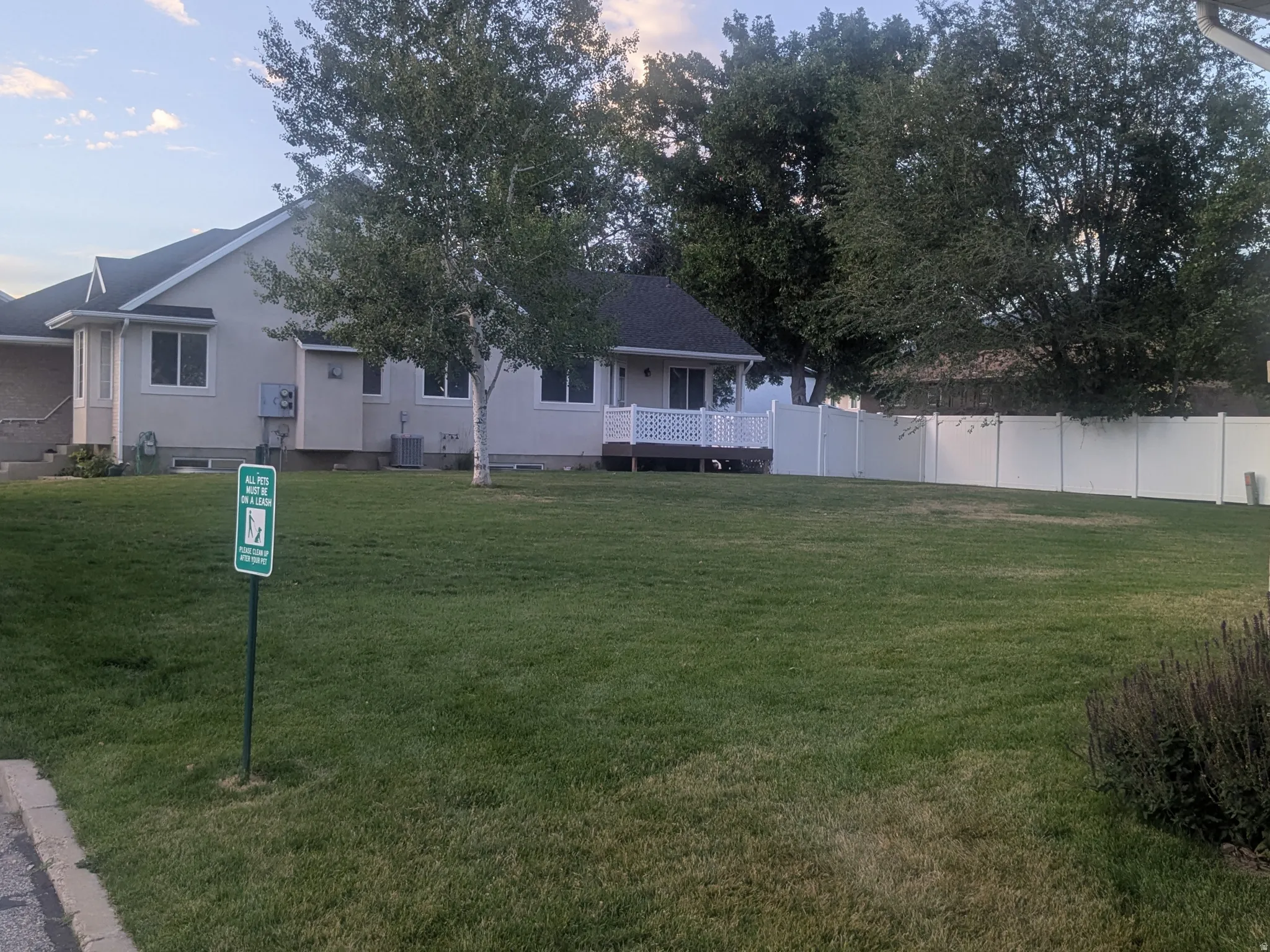 Expansive green space featuring a large lawn area