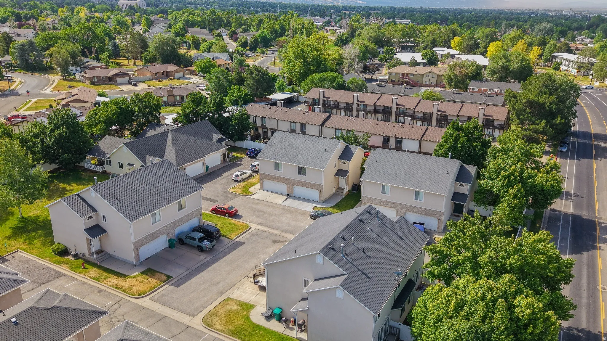 Aerial perspective showcasing modern townhomes with attached garages