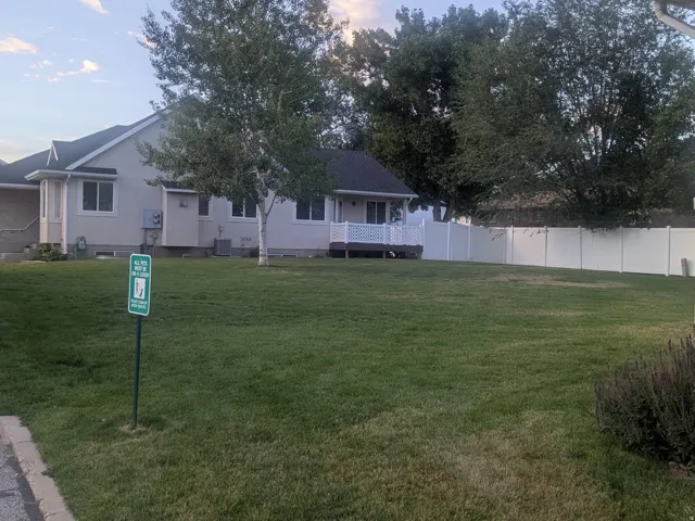 Expansive green space featuring a large lawn area