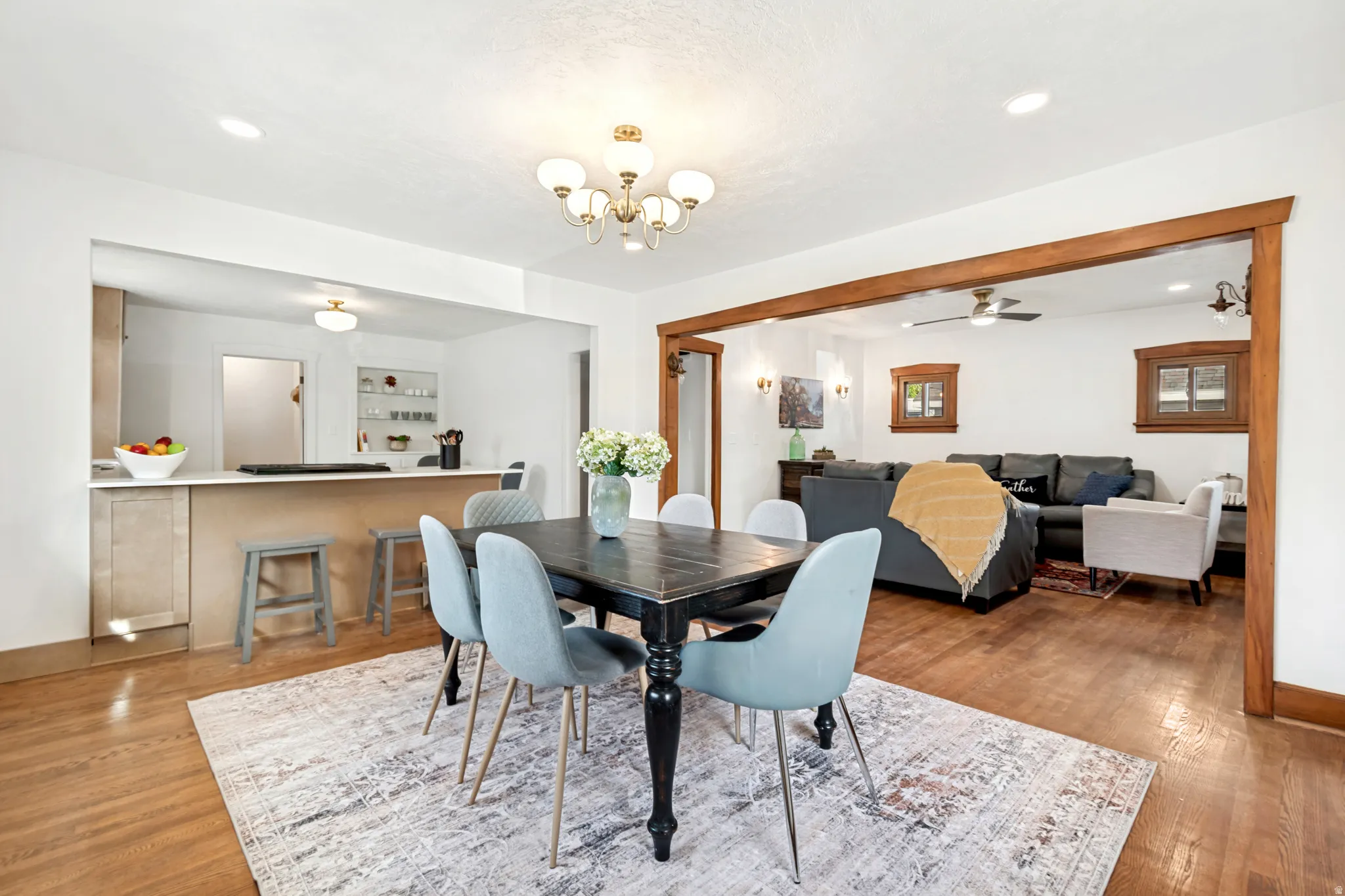 Dining area featuring wood-finish flooring and a central chandelier
