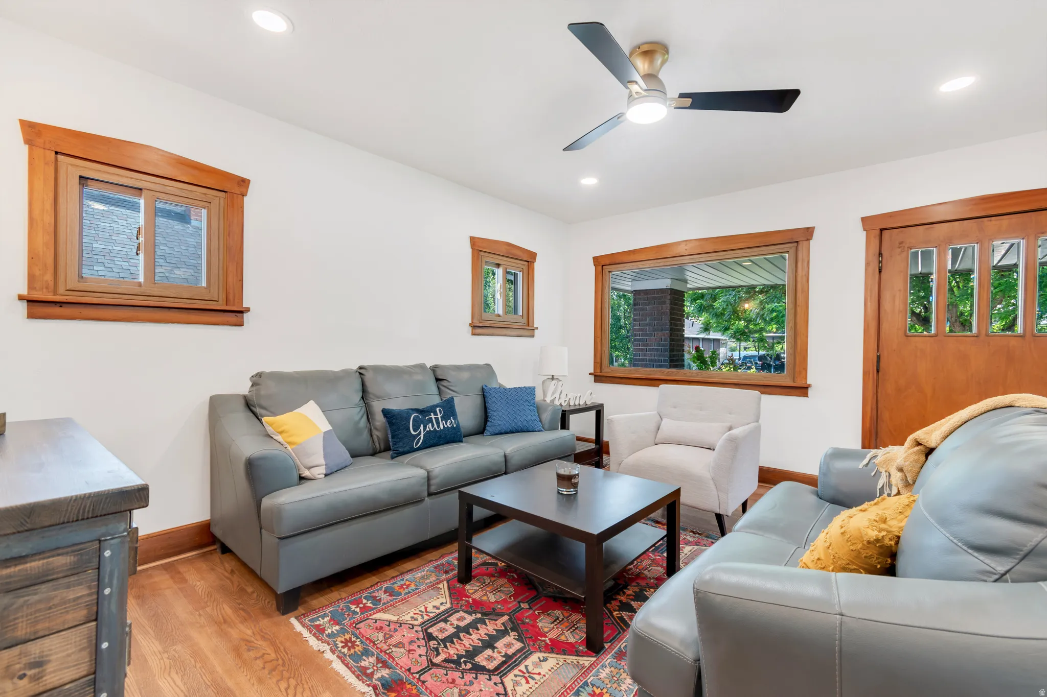 Open concept living area featuring wood-finish flooring, recessed lighting, and a contemporary ceiling fan