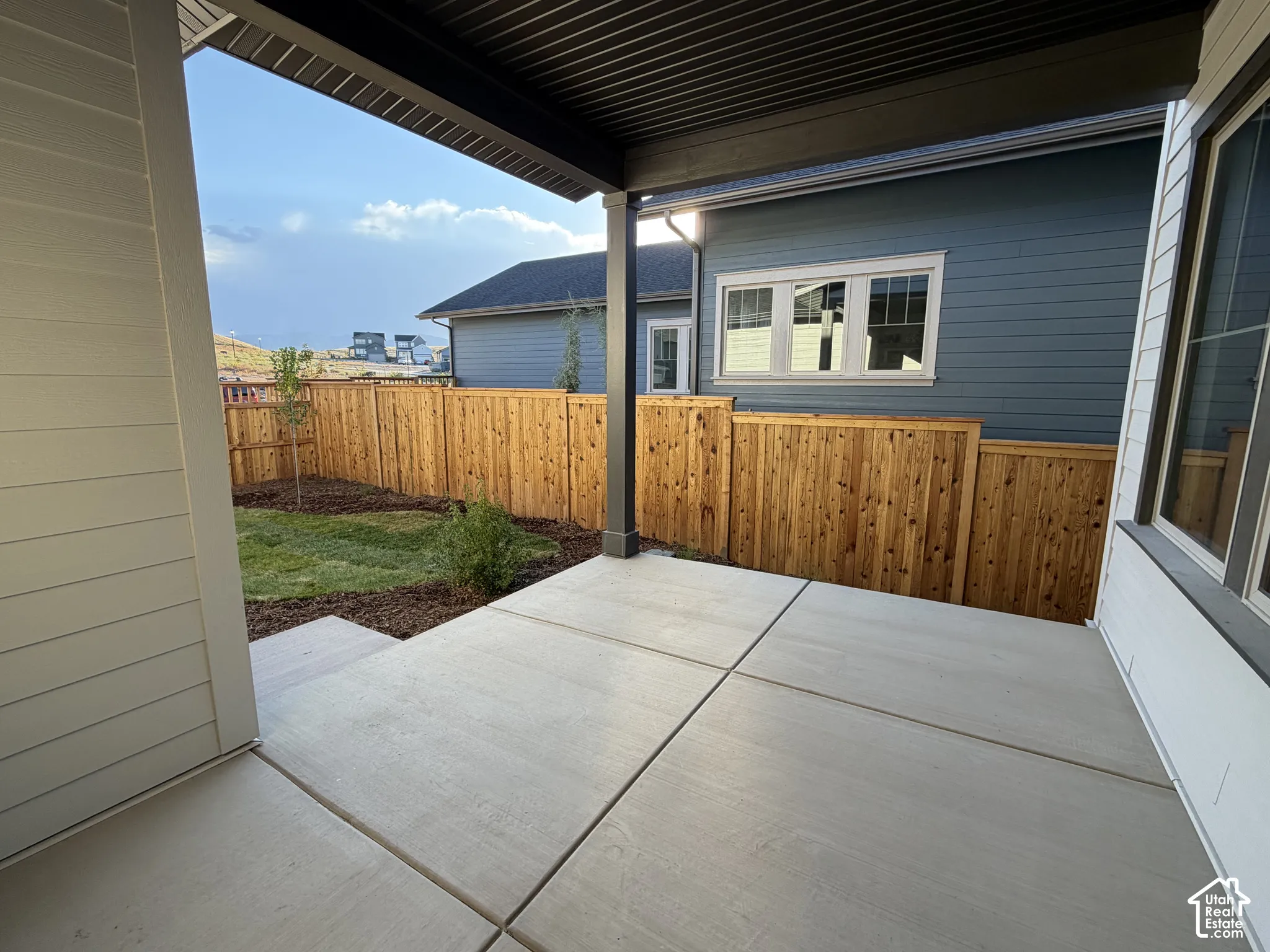 Covered patio with a concrete surface